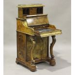 A mid-Victorian walnut pop-up piano-top Davenport, the rising weight-driven gallery back above a