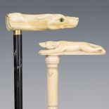 A 19th century sectional full-length ivory walking cane, the handle carved in the form of a dog,