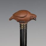 A late 19th century ebonized walking cane, the Chinese Yixing stoneware handle modelled as a bird,