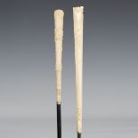 An Edwardian ebonized walking cane with a long foliate carved ivory handle above a plated collar,