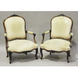A pair of late 19th century French rosewood showframe fauteuil armchairs, upholstered in a patterned