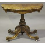 A Victorian walnut shaped demi-lune fold-over card table, raised on carved legs, height 73cm,