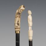 A 19th century ebonized walking cane, the bone handle as a seated naked figure above a gilt metal