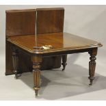 A mid-Victorian mahogany extending dining table, the moulded top with two extra leaves, raised on