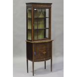 An Edwardian mahogany and satinwood crossbanded display cabinet with inlaid decoration, the glazed
