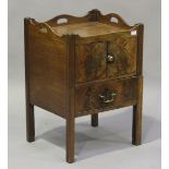 A George III figured mahogany night cupboard, the galleried top with pierced handles above a