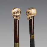 Two late 19th/early 20th century walking canes, both with carved bone skull pommels above