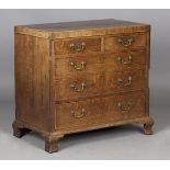A George III oak provincial chest of drawers with mahogany banding and boxwood stringing, the oak-