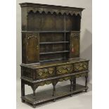 A late 20th century George III style provincial oak dresser, in the manner of Titchmarsh &