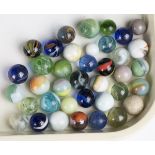 A collection of assorted marbles, including some earlier examples.Buyer’s Premium 29.4% (including