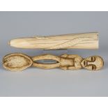 A 19th century African carved tusk, worked with a curling serpent, length 18.5cm, together with an