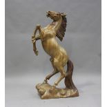 A large late 20th century carved hardwood model of a rearing horse, indistinctly signed 'Wayan
