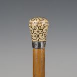 A late 17th/early 18th century Malacca walking cane, the ivory handle with silver piqué inlaid