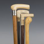 A late Victorian Malacca walking cane with an ivory handle and silver collar, length 87.5cm,