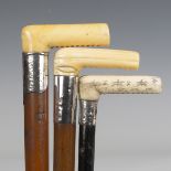 A 19th century Malacca walking cane with ivory handle and engraved silver collar, length 81cm (