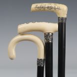 A late Victorian ebonized walking cane, the ivory handle engraved with the Rod of Asclepius, dated