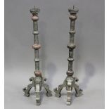 A pair of Portuguese silvered and pink painted wooden pricket candlesticks, height 78cm.Buyer’s