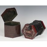 An early 20th century Lachenal & Co patent concertina, each pierced fretwork end with twenty-four
