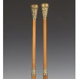 A pair of 19th century Malacca and gilt brass mounted ecclesiastical staves, probably for use in a