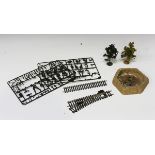 A collection of OO gauge railway track, plastic trees, lineside accessories, plastic kits, model