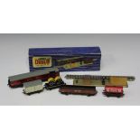 A collection of Hornby Dublo three-rail goods rolling stock, including two T.P.O. mail van sets,