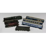 A collection of Tri-ang gauge OO locomotives and rolling stock, including a 2-10-0 locomotive '