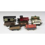 A collection of Hornby gauge O and other goods rolling stock, including a snowplough, a Bassett-