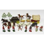 A collection of lead figures and accessories, including two Britains cows, seven Canadian