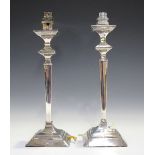 A pair of George V silver candlesticks of tapered square section, Sheffield by Fenton Brothers
