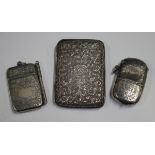 A late Victorian silver vesta case with hinged lid and hinged sovereign compartment, engraved with