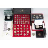 A small group of coins, including an Elizabeth II piedfort issue silver proof commemorative five
