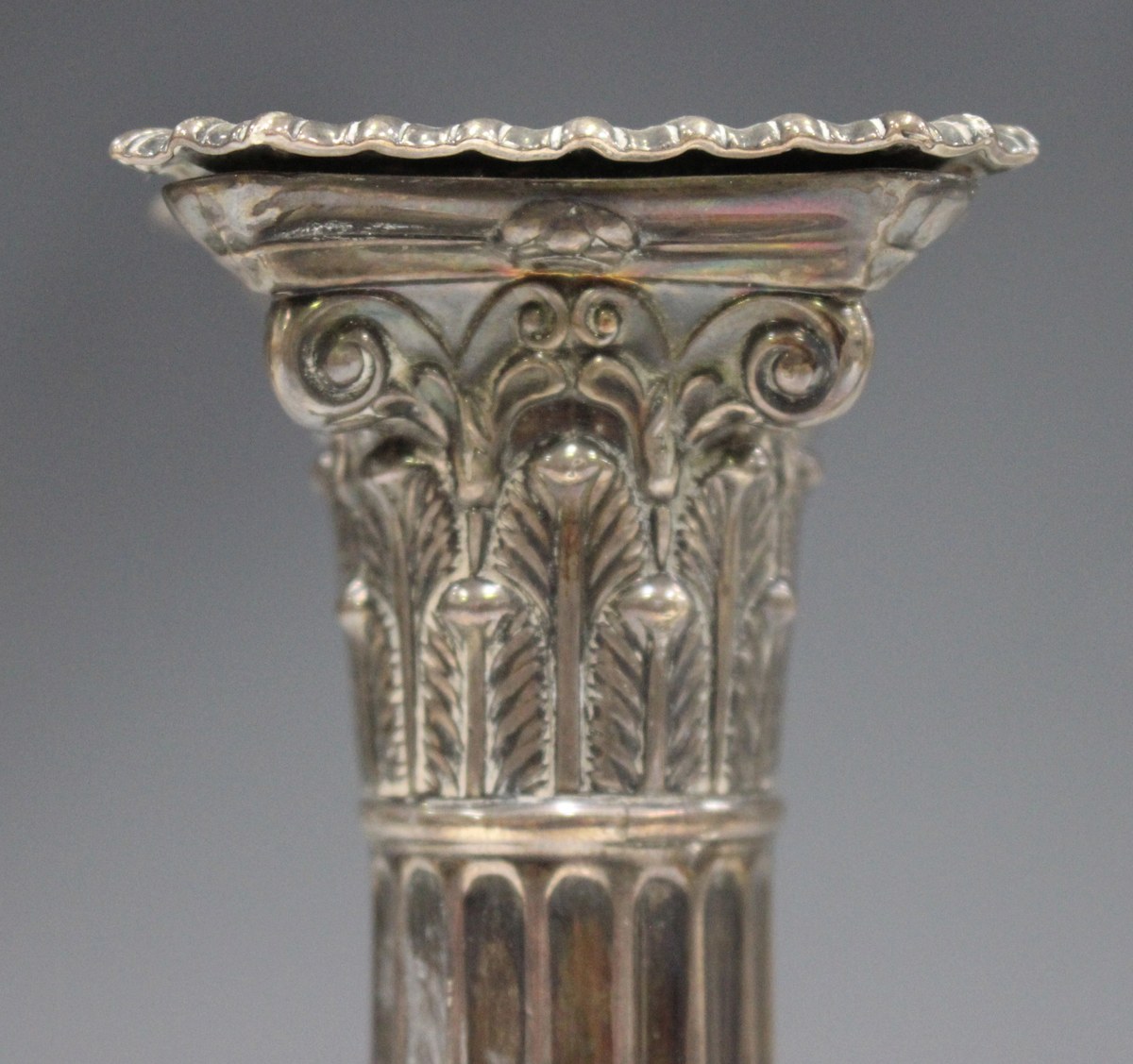 A pair of late Victorian silver Corinthian column candlesticks, each with detachable nozzle on a - Image 3 of 3