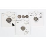 A group of Maundy coins, comprising a Charles II twopence 1677, an Anne twopence 1704, two George