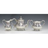 A Victorian silver three-piece tea set, comprising teapot, milk jug and two-handled sugar bowl, each