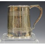 A George V silver christening mug of tapered cylindrical form with banded detail, Birmingham 1920 by