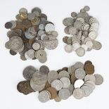 A collection of British and foreign coins, including pre-decimal, pre-1920 and pre-1947 shillings,