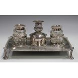A William IV Sheffield plate ink stand, fitted with a cut glass inkwell and pounce pot flanking a