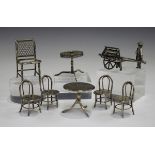 A small group of Chinese white metal miniatures, comprising a tripod table and four matching chairs,