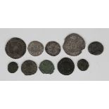 A small group of Roman bronze coins, including a Maximianus Antoninianus, a Constantine I AE3 and