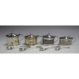 An Edwardian silver oval mustard with hinge lid and blue glass liner, London 1901 by Goldsmiths &