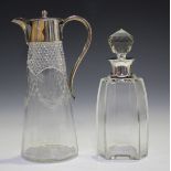 An Edwardian silver mounted engraved and cut glass claret jug, the tapered cylindrical body with