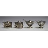 A pair of late Victorian silver oval mustards, each with pierced and embossed festoon decoration,