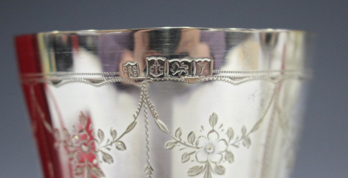 A pair of Elizabeth II silver goblets, each gilt-lined tapered bowl engraved with floral garlands, - Image 3 of 3