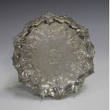 A George III silver card salver with scroll rim, the centre engraved with crest and motto 'Think On'