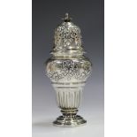 A Continental silver sugar caster of ogee baluster form with pierced dome cover, decorated in relief
