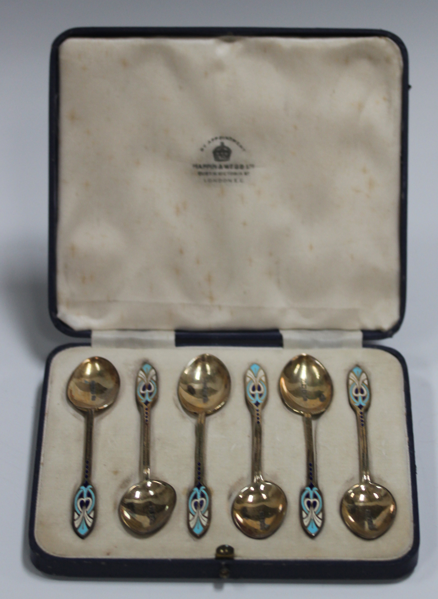 A set of six Art Deco silver gilt and enamel coffee spoons, Birmingham 1938 by Mappin & Webb, cased,