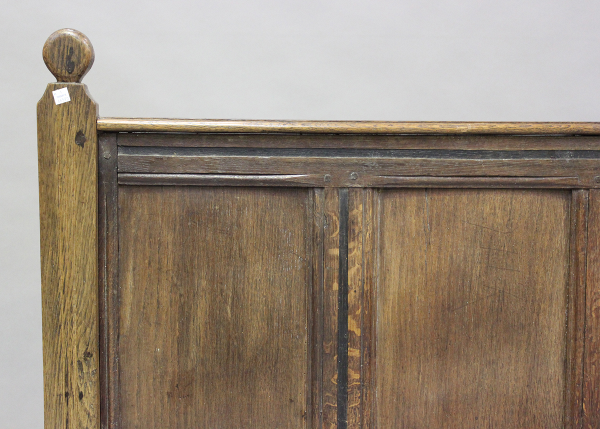 A 17th century and later oak panelled double headboard, height 130cm, width 139cm.Buyer’s Premium - Image 7 of 7