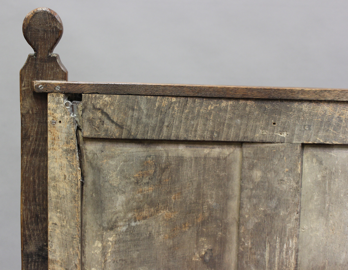 A 17th century and later oak panelled double headboard, height 130cm, width 139cm.Buyer’s Premium - Image 2 of 7