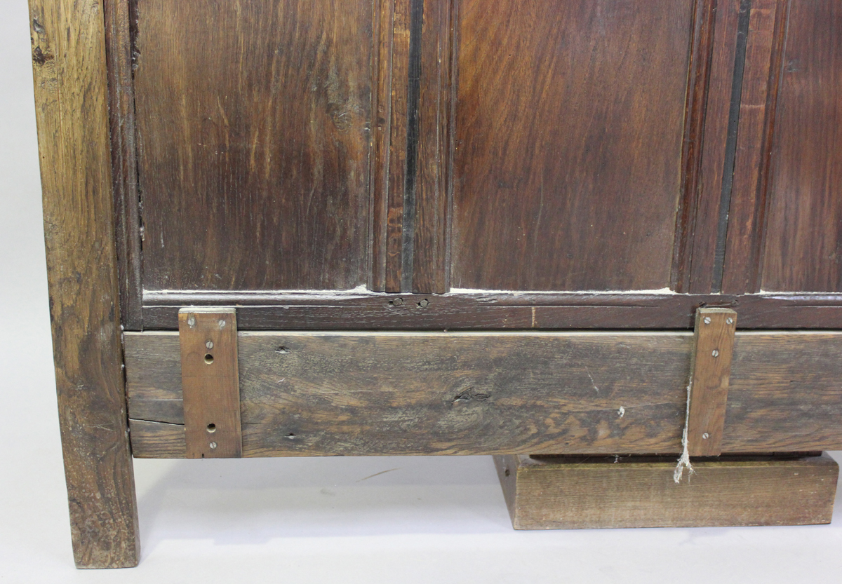 A 17th century and later oak panelled double headboard, height 130cm, width 139cm.Buyer’s Premium - Image 6 of 7