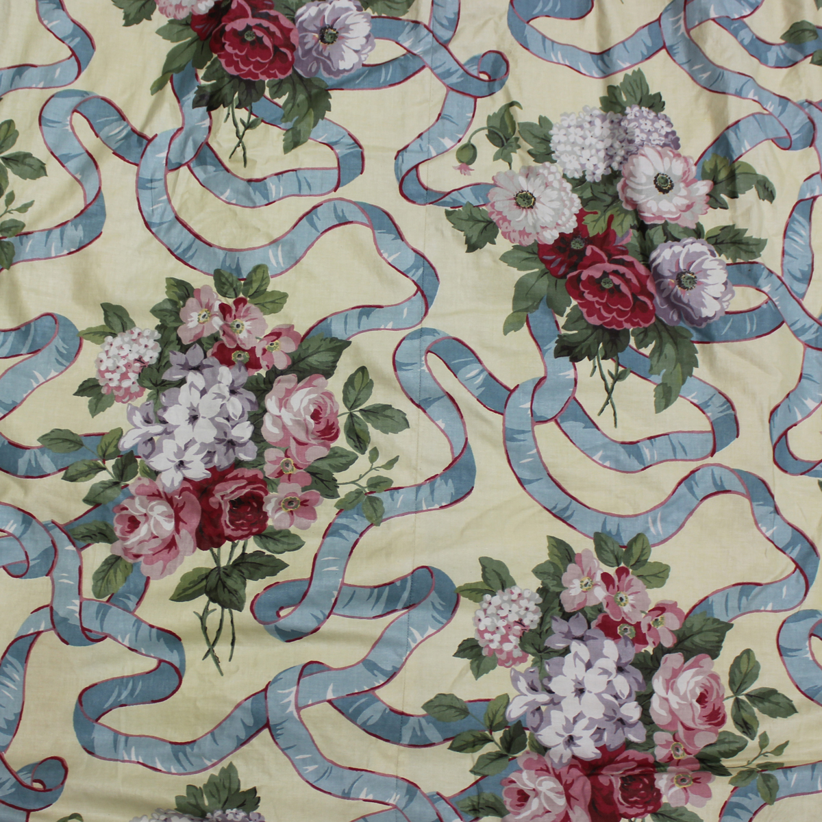 Three pairs of modern printed cotton floor-length curtains, decorated with blue ribbons and rose